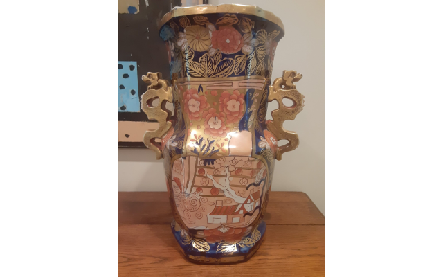 An 18”-high vessel is one of two hand-decorated Chinese vases.
