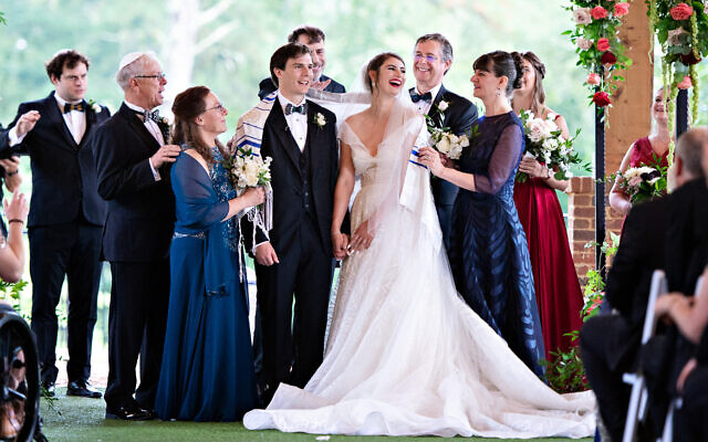 Alexandra and David enjoy a special moment. Her gown was by Israeli designer Inbal Dror.