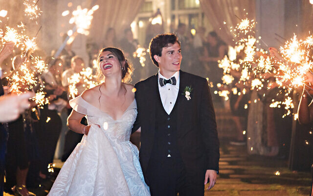 The couple made their way to the after party between a double row of sparklers.