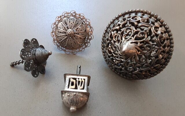 Silver dreidels from Aunt Alice; the modern one in front shows the word “sham.”