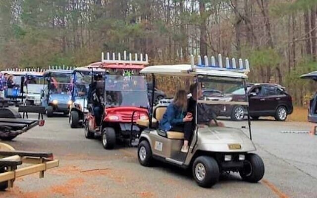 Most of the golf carts had to be transported on a trailer to the starting location to participate.