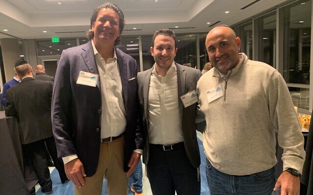 Eric Miller (left) and Ross Fishbein (right) flank Rabbi Yosef Shapiro, who has grown the Brookhaven Kollel to 600 participants.
