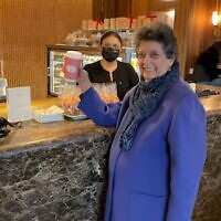 After showing her COVID vaccination card, Flora was able to take off her mask at the coffee bar.