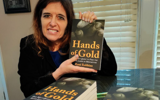 Roni Robbins with the first shipment of her new book, “Hands of Gold.”