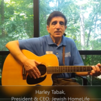 Tabak is known as the “singing CEO” because of the traditional Jewish songs and American folk classics that he performs for residents.