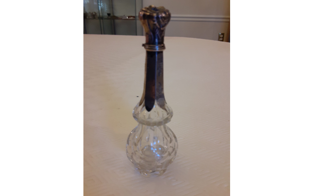Antique crystal and silver perfume bottle.