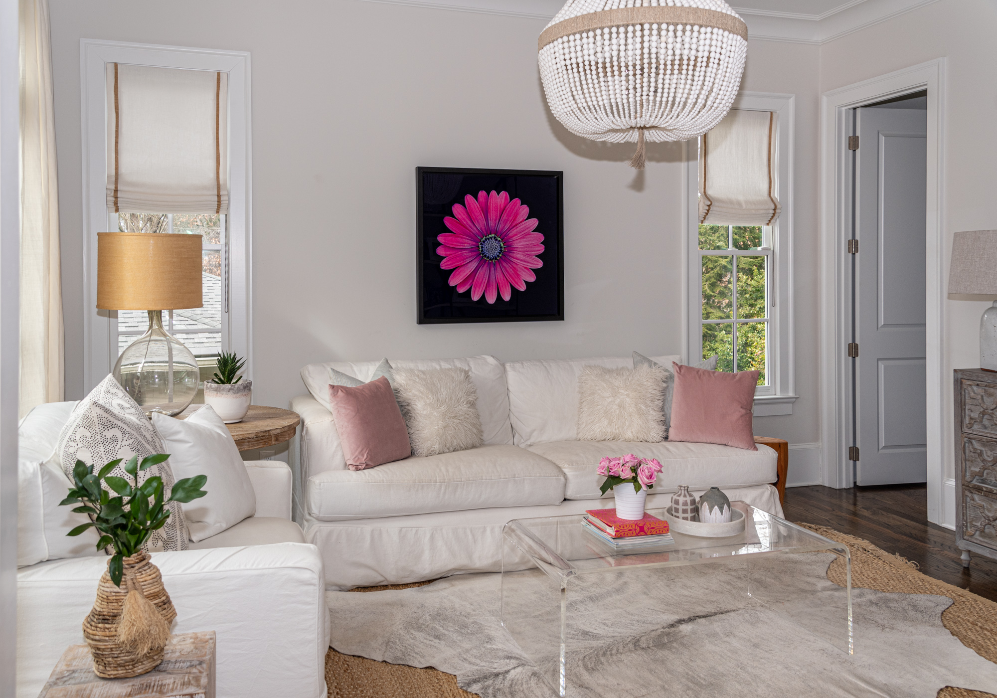 The Pastner daughters enjoy playtime in the parlor. Jody Goldstein’s flower photo adds whimsy to the space.