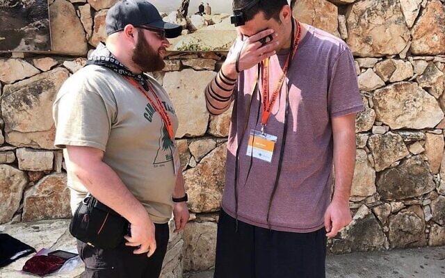Kyle Simon davening in Israel with another participant on his 2018 Birthright trip.
