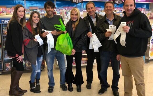 The Goldsteins join friends and family in paying off holiday layaway debt at Toys “R” Us.