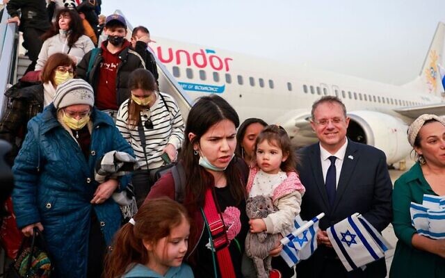 Passengers disembark from an airplane carrying Jewish immigrants fleeing the war in Ukraine, upon arrival in Israel's Ben Gurion Airport in Lod near Tel Aviv, on March 6, 2022. - Hundreds of Ukrainians are set to arrive in Israel over the weekend, the body in charge of processing immigration for Jews abroad said on March 2, following Russia's invasion of its neighbour. (Photo by Menahem KAHANA / AFP) (Photo by MENAHEM KAHANA/AFP via Getty Images)