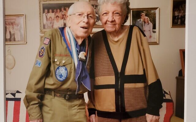 Benator poses in Scoutmaster uniform, with wife Birdie.