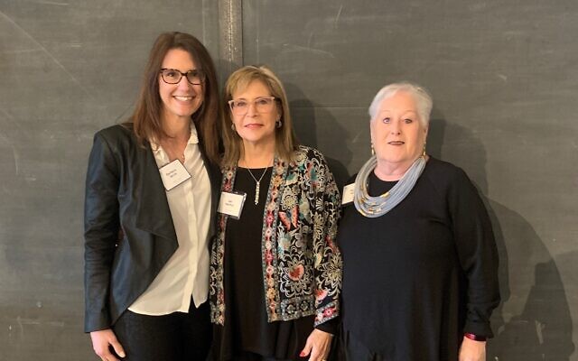 Pausing to chat under the ORT 100 sign, (L to R) ORT International CEO Barbara Birch, local ORT President Sari Marmur and ORT Regional Director Rachel Miller.