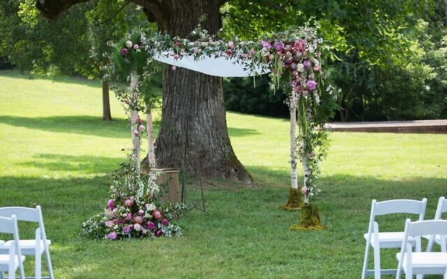 A beautiful, outdoor summer wedding at Barnsley Gardens called for a bright colored, organic looking chuppah.. // Credit: 6 of Four Photography