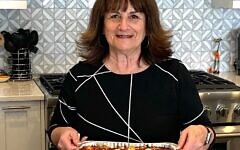 Lasagna Love Global Outreach Director and Alpharetta chef Lynn Hirsch prepares lasagna in her kitchen.