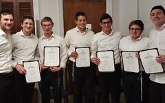 This year’s NHS inductees, left to right: Yehoshua Cohen (a member since his junior year), Shalom Dovid Schulgasser, Aaron Blanks, Moshe Yehuda Golding, Avi Tanenbaum, Aron Pitocchelli and Donny Grossblatt.