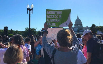 A protester holds up a sign reading “Abortion Access is a Jewish Value” at a rally in front of the U.S. Capitol Building organized by the National Council for Jewish Women, May 17. (Julia Gergely-JTA)