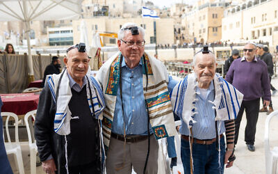 George (center), together with Oscar and Walter, at their family reunion at the Western Wall // Photo Credit: United Hatzalah