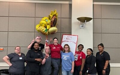 Jodi Wittenberg, one of the blood drive organizers (blue t-shirt) with nurses and staff from LifeSouth Community Blood Centers.