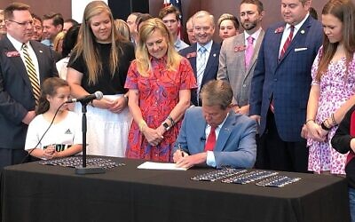 Govenor Brian Kemp signing several laws reguarding education.  //  Courtesy of the Georgia governors office.