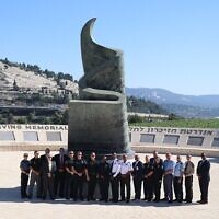 The delegation stands at the foot of the monument at the 9/11 Living Memorial Plaza in Ramot, Jerusalem // Photo Credit: GILEE