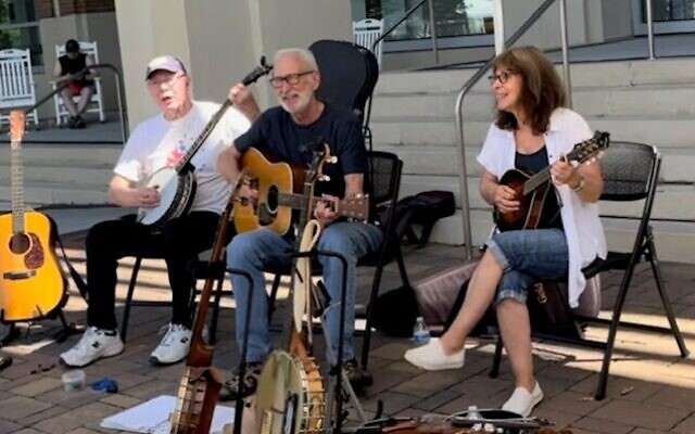 Ross and Teresa Friedman (right) are regular performers at City Springs. Edwin Hall (left) on banjo, Ross on guitar and Teresa on mandolin.