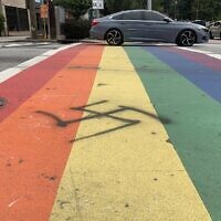 A swastika spray-painted on the “rainbow” crosswalks at the intersection at Piedmont and 10th Street in Atlanta was power-washed away Wednesday night by a city crew within hours of its discovery. // Photo courtesy of Adam Van Wickel