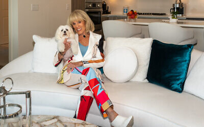 Joanne poses with Maltese, Brutus, in her glamorous apartment overlooking Peachtree Road.  //  Photo Credit: Howard Mendel