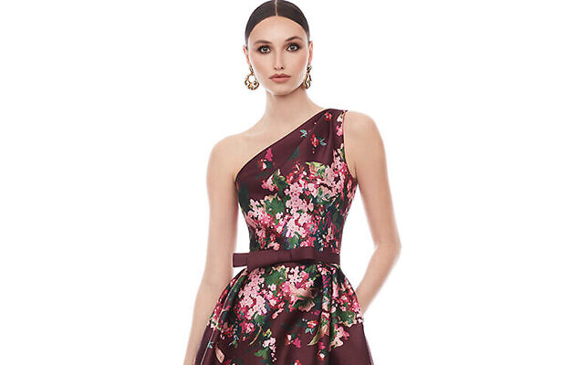 The lovely floral pattern on this berry-colored gown is carried onto the back of the dress and perfect for an elegant fall or winter evening wedding. By Frascara at Susan Lee