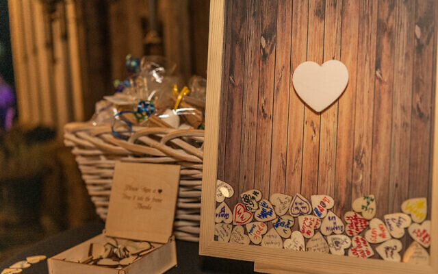 Guests were encouraged to put heart notes in the glass frame for the couple to cherish.
