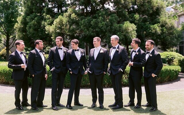 Blum surrounded by his groomsmen.