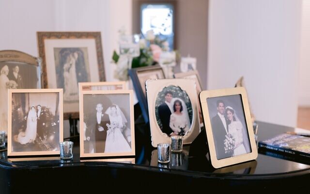 Generations of family wedding photos displayed.