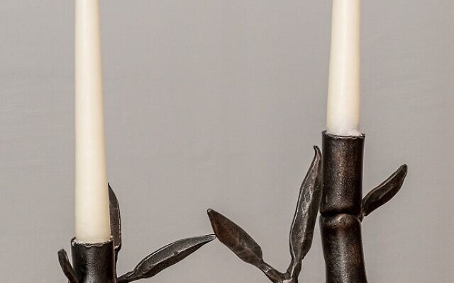 Sephora hand crafted these candlesticks which are steel in the form of bamboo. // Photo Credit by Howard Mendel.