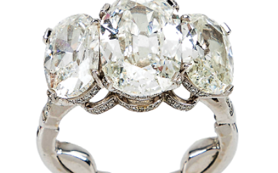 GIA-certified 8.81-carat total weight, three-stone diamond and platinum ring.