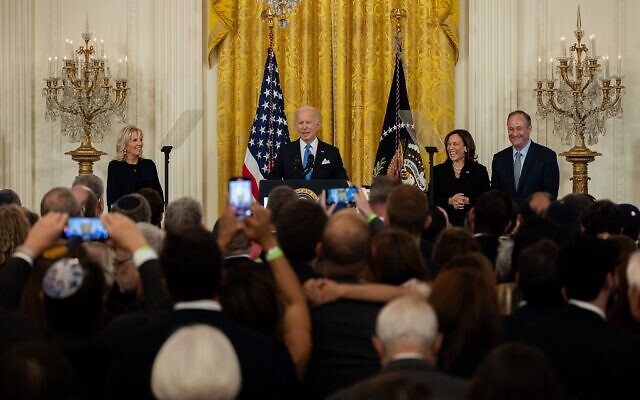 (From left) First Lady Dr. Jill Biden looks on as President Joe Biden speaks while Vice President Kamala Harris and Second Gentleman Doug Emhoff share a laugh.