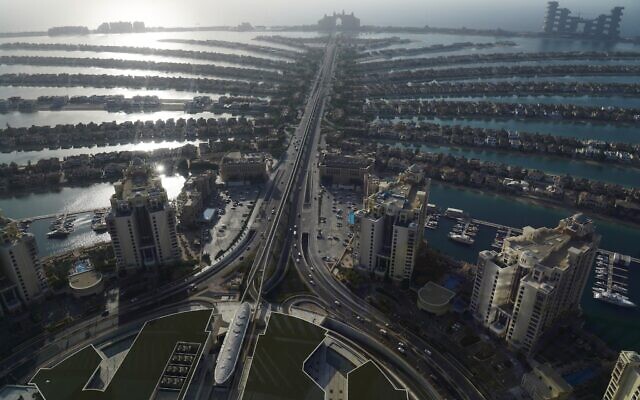 Islands and jetties of the manmade Palm Jumeirah archipelago stretch out across the Persian Gulf in Dubai, United Arab Emirates, Monday, July 19, 2021. (AP/Jon Gambrell)