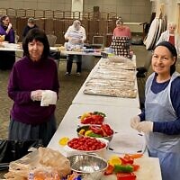 It was all hands on deck while preparing for the lavish, outsized gathering in Toco Hills at Congregation Beth Jacob as part of the Shabbat Block Party: A Gala Kiddush.