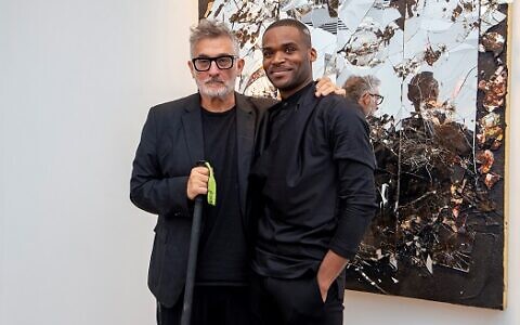 Featured artist Michael David poses with Bill Lowe Gallery director Donovan Johnson.