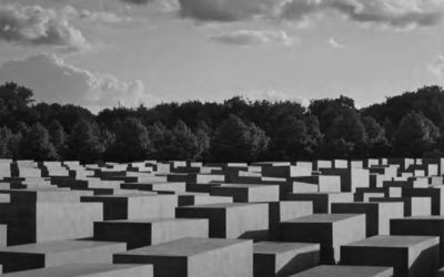 The Holocaust Memorial in Berlin contains 2,711 grey concrete boxes in rows that invite the visitor to walk among them.  //  Credit Jason Langer