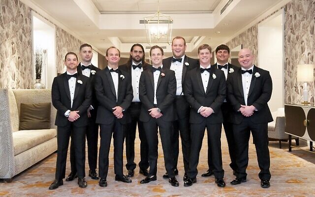 Aaron Retterbush (center, front row) pictured with his groomsmen