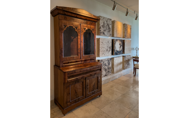 In Shapero’s foyer is this wood secretary (1890) from Fitzgerald, Ga. The nine canvas squares were originally a sculptor’s floor cloth