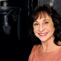 Voiceover artist Laura Doman pictured in her studio photo booth, is known for her warm and friendly conversational reads, and lively and bright quirky characters.