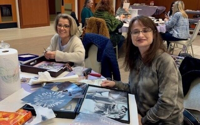 Volunteers at Etz Chaim are pictured creating collaged wood trays as a fundraising project called, “Art for a Mitzvah.”