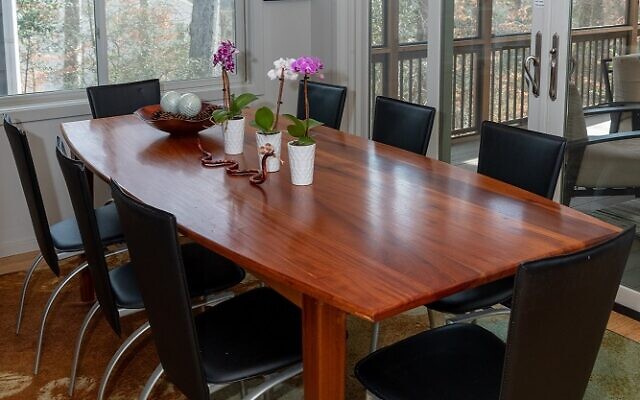 Larry made this dining table out of mahogany. Natural light and woods pervade the home.
