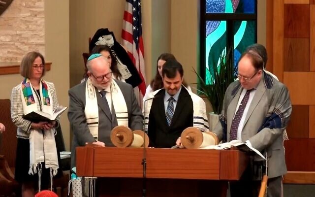 After practicing for about a year, Eric Cole reads his Torah portion with his grandfather’s talis.