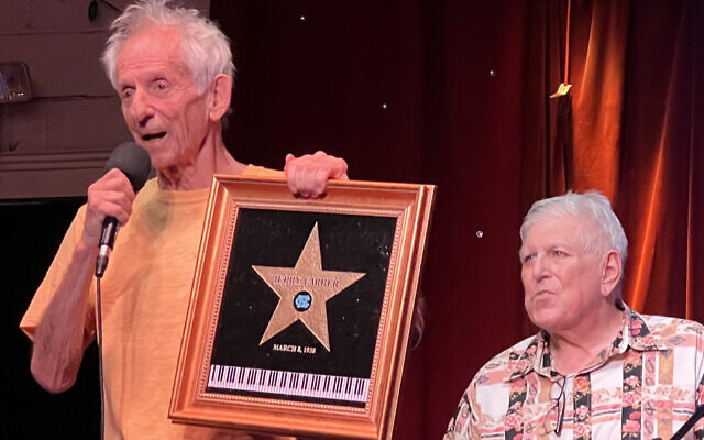Jerry Farber and Howard Osofsky with the birthday gift of a black marble star.