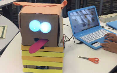 Example of ARTBotics from STEAM Camp for first-time coder and robot builder. The children got to design a robot that makes them laugh. Its tongue wags back and forth while the eyes blink. Made with cardboard, foam paper, and Styrofoam balls. Compliments of the Birdbrain Technologies Hummingbird Kit.