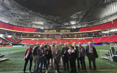 A tour group from Ahavath Achim Synagogue is pictured on the field at Mercedes-Benz Stadium.