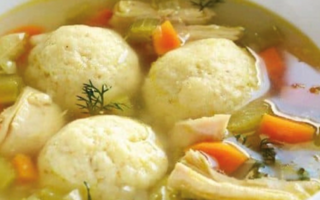 Marci Alt’s matzoh ball soup comes with three to four fluffy balls.