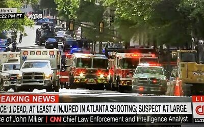 This screenshot, taken from a CNN telecast and posted to Twitter, shows the crime scene outside of Dr. Scott Kleber’s medical office in Midtown.