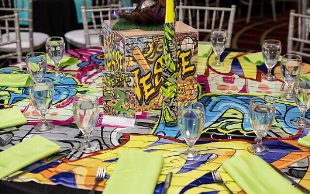 The table décor featured vibrant, colorful graffiti art, per Jesse’s request.